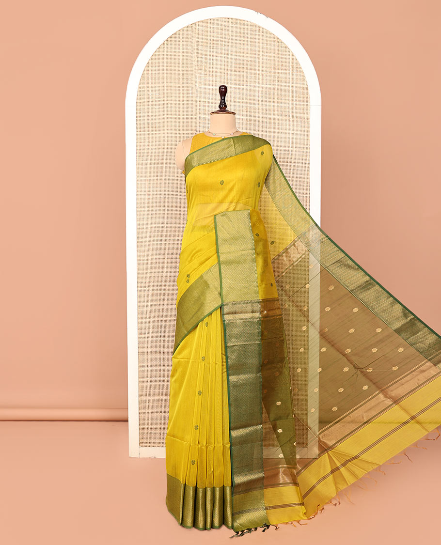 Yellow Maheshwari Cotton Saree, Bedecked with Floral Buttas on Its Body, Complemented by a Contrast Border of Traditional Designs, Pallu Steeped with Buttas, and Paired with a Contrast Blouse