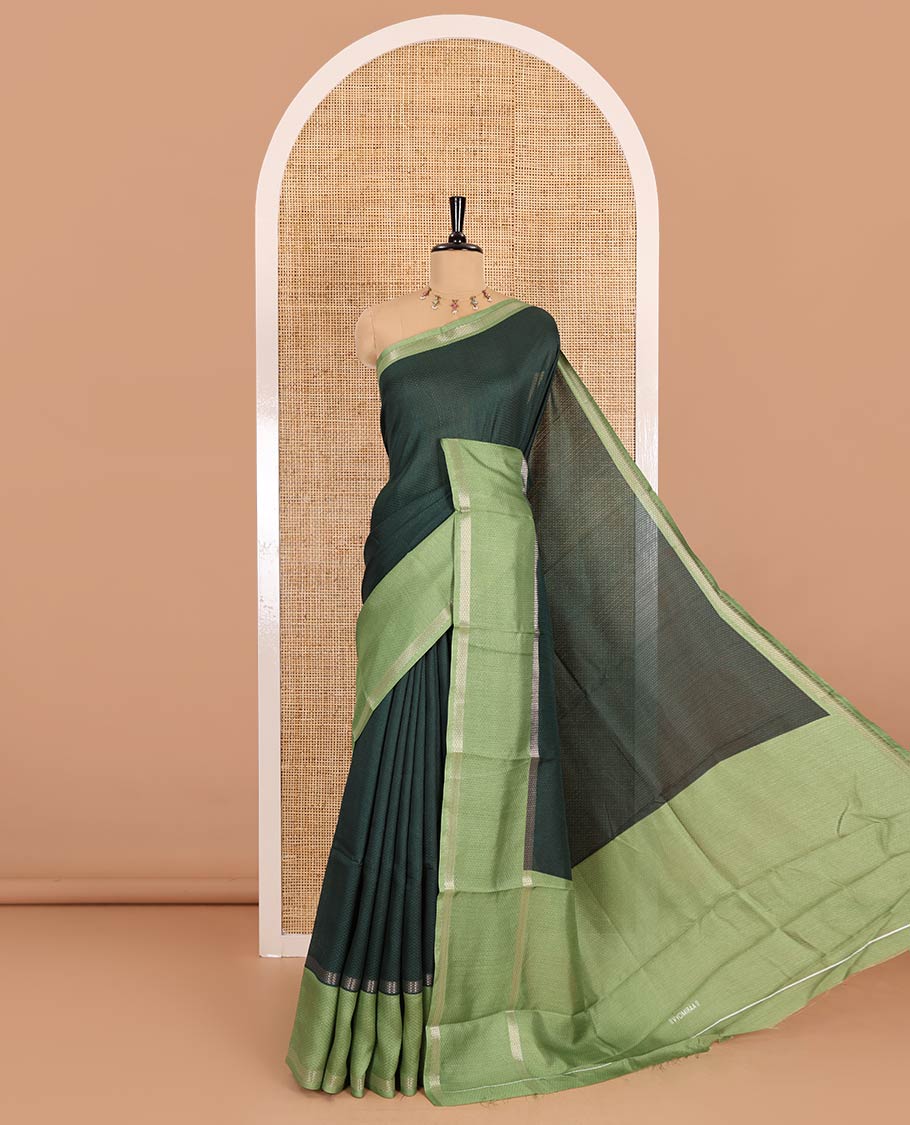 Green embossed moss chiffon saree, contrast traditional rettai pettu border, embossed pallu, and a contrast embossed blouse