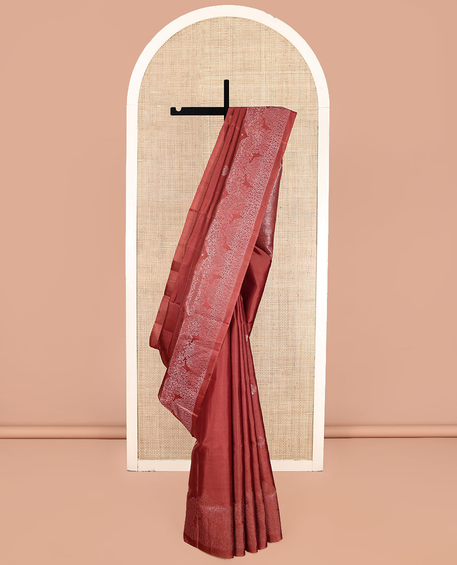 Red Mayuri Soft Silk Saree, Graced with Zari Buttas, a Self-Border, and a Pallu Features an Intricate Weave and a Matching Blouse