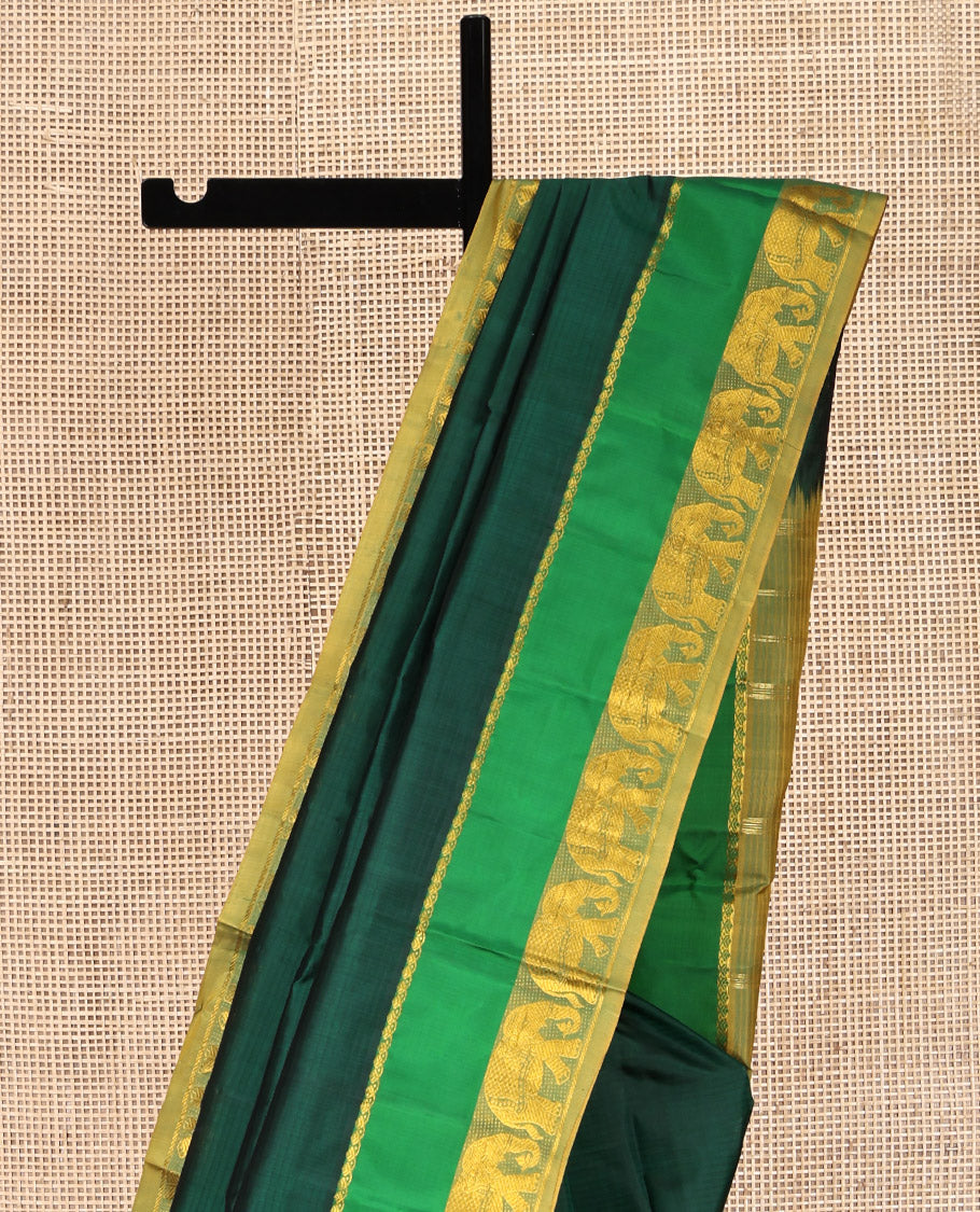 Green Kanchipuram Silk Saree, Sparsely Woven with Vazhaipoo Stripes on Its Body, Complemented by Contrast Rettai Pettu Border of Salngai, and Yaanai Designs, Zari-Striped Pallu, and Paired with a Contrast Blouse