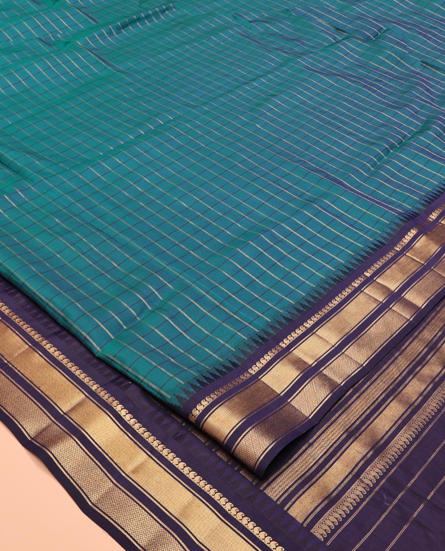 Mayil Color and Navy Blue Vasundhara Lite Silk Mix Saree, Graced with Checked Design All Over Its Body, Complemented by a Contrast Thazampoo Rekku Border of Manga Mokku, Muthu, and Mayil Kann Designs, Grand Pallu, and Paired with a Contrast Blouse