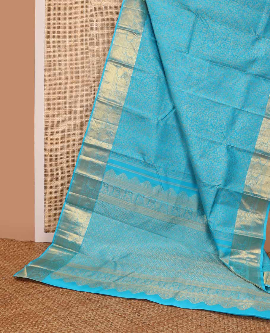 Blue floral jacqaurd silk saree with contrast design of thilakam mokku, banaras, manga design & floral pallu