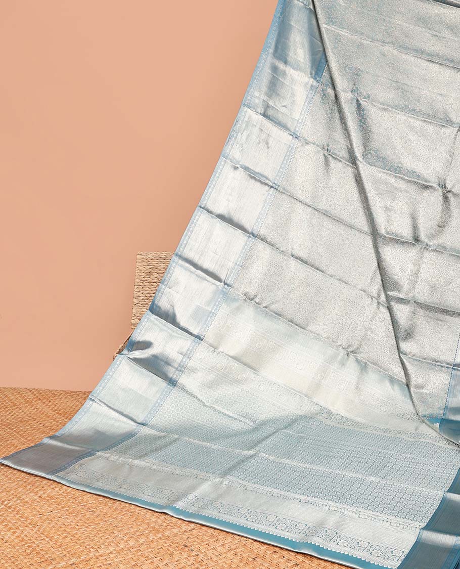 Blue floral jacquard tissue saree with contrast border of thilakam mokku, muthu, paun, banaras designs & floral jaal zari design pallu