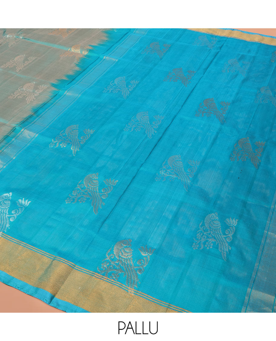 Blue Uppada Silk Saree Accentuated with Parrot Zari Buttas, Complemented by Bavanji Border, Contrast Pallu Steeped with Parrot Zari Designs, and Paired with a Contrast Blouse