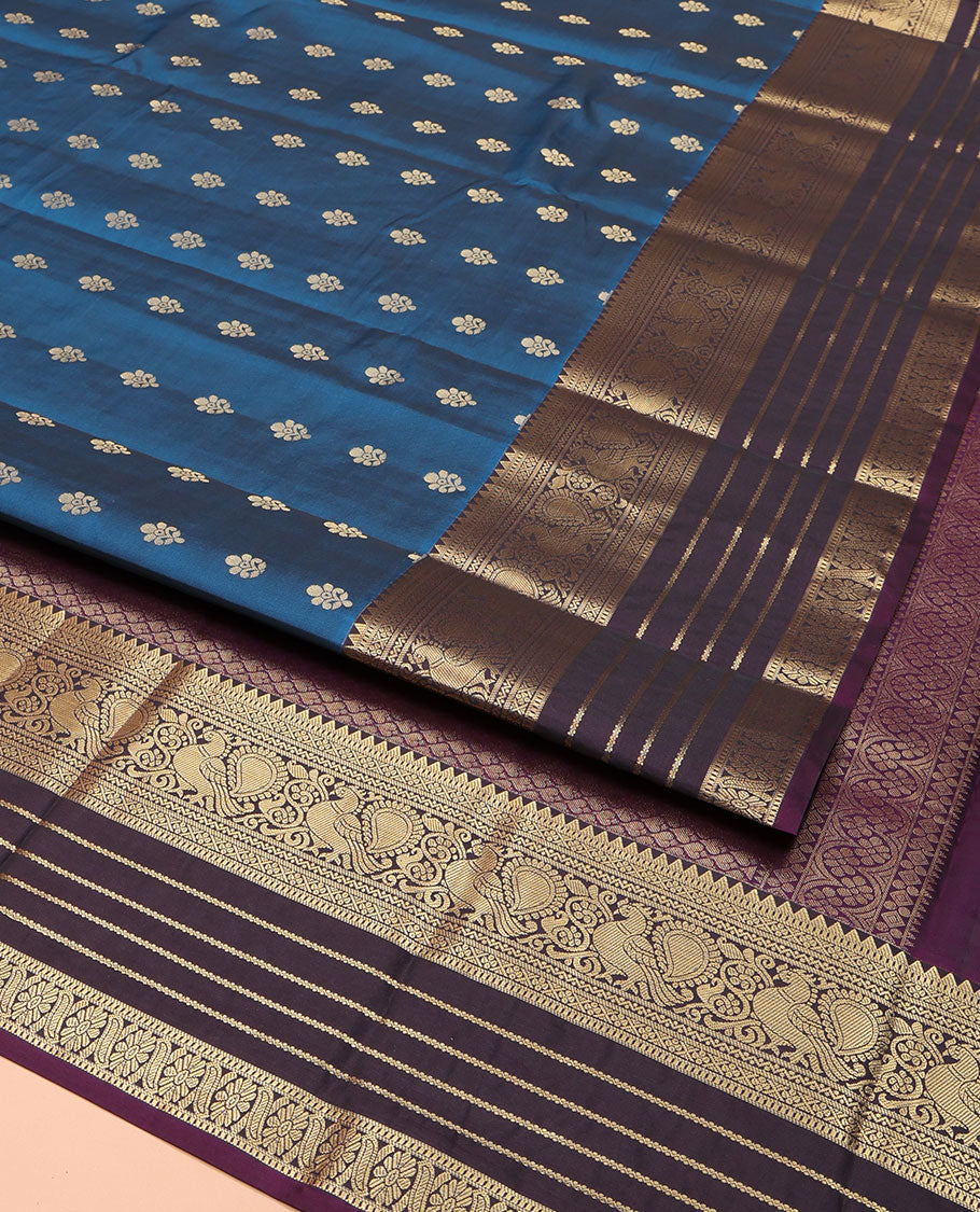 Blue Vasundhara Lite Silk Mix Saree, Mesmerized with Zari Buttas on Its Body, Complemented by a Contrast Varisai Pettu Border of Rekku, Muthu, Neli, Mayil, and Cross Kamalam Designs, Beautifully Bedecked Pallu, and Paired with a Contrast Blouse