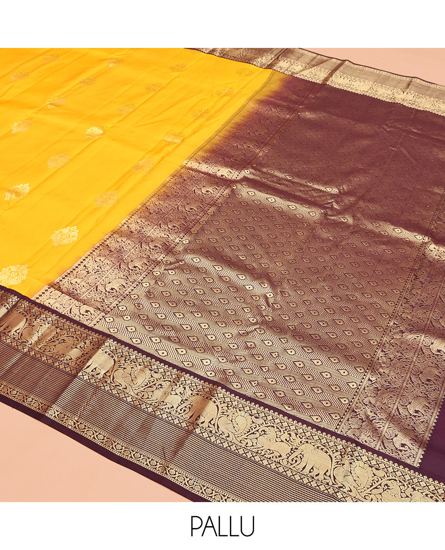 Yellow Vasundhara Silk Saree, Richly Detailed with Zari Buttas, Contrast Border of Thilakam Mokku, Mayil Kann, Yaali, Yaanai, Mayil, and Kodi Visiry, Grand Pallu, and a Contrast Blouse
