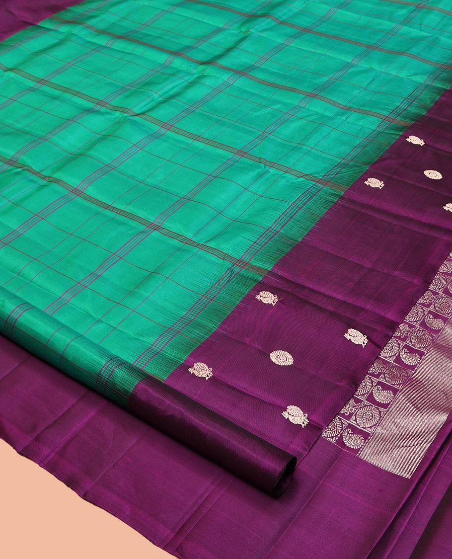 Green Checked Kanchipuram Silk Saree, Complemented by a Contrast Mayil-Chakram Border, Pallu of Butta Enclosed Checks, and a Contrast Blouse