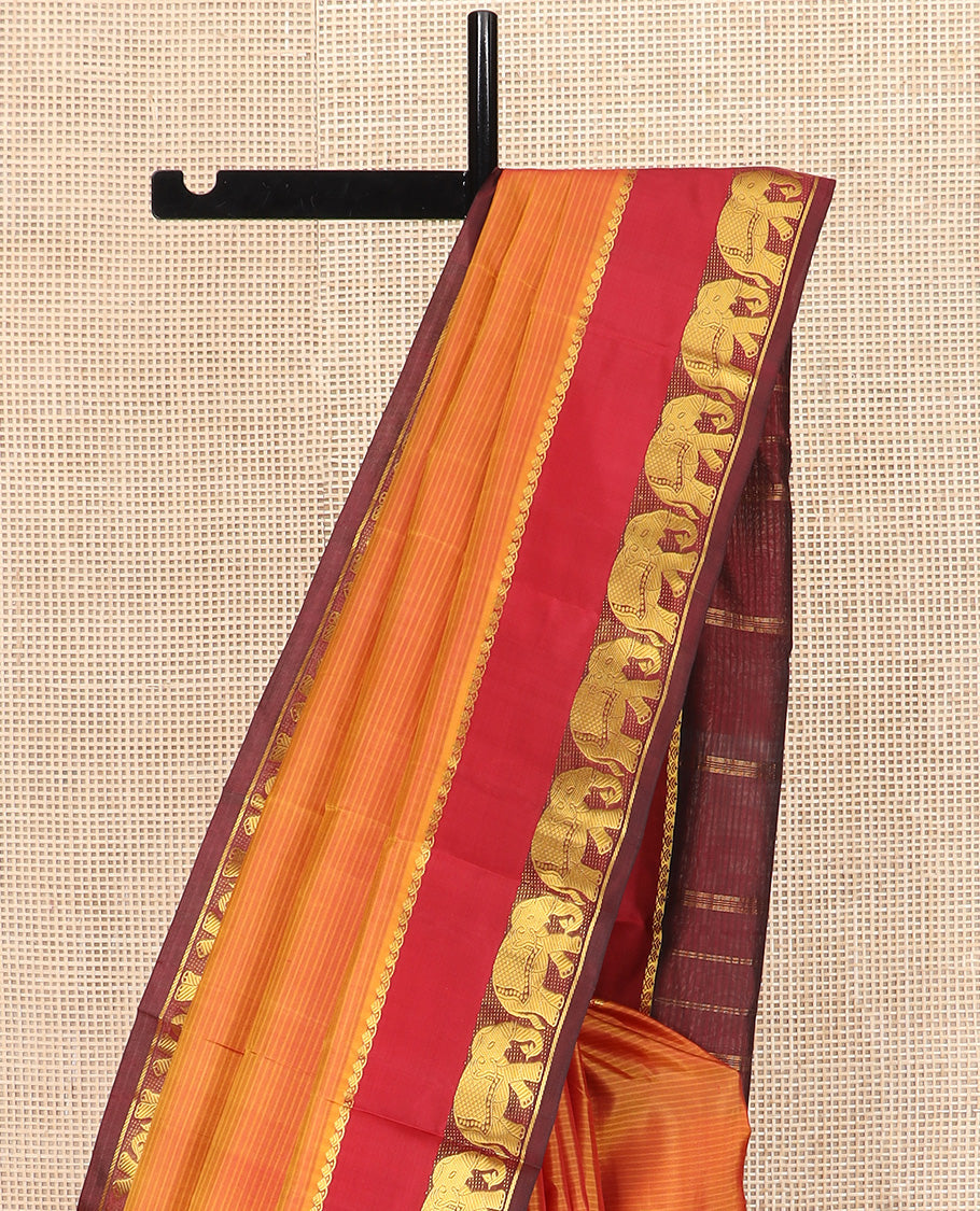 Orange Vazhaipoo Striped Kanchipuram Silk Saree, Complemented by Contrast Rettai Pettu Border of Thilakam Mokku, and Yaanai Designs, Pallu Subtly Woven in Stripes, and Paired with a Contrast Blouse