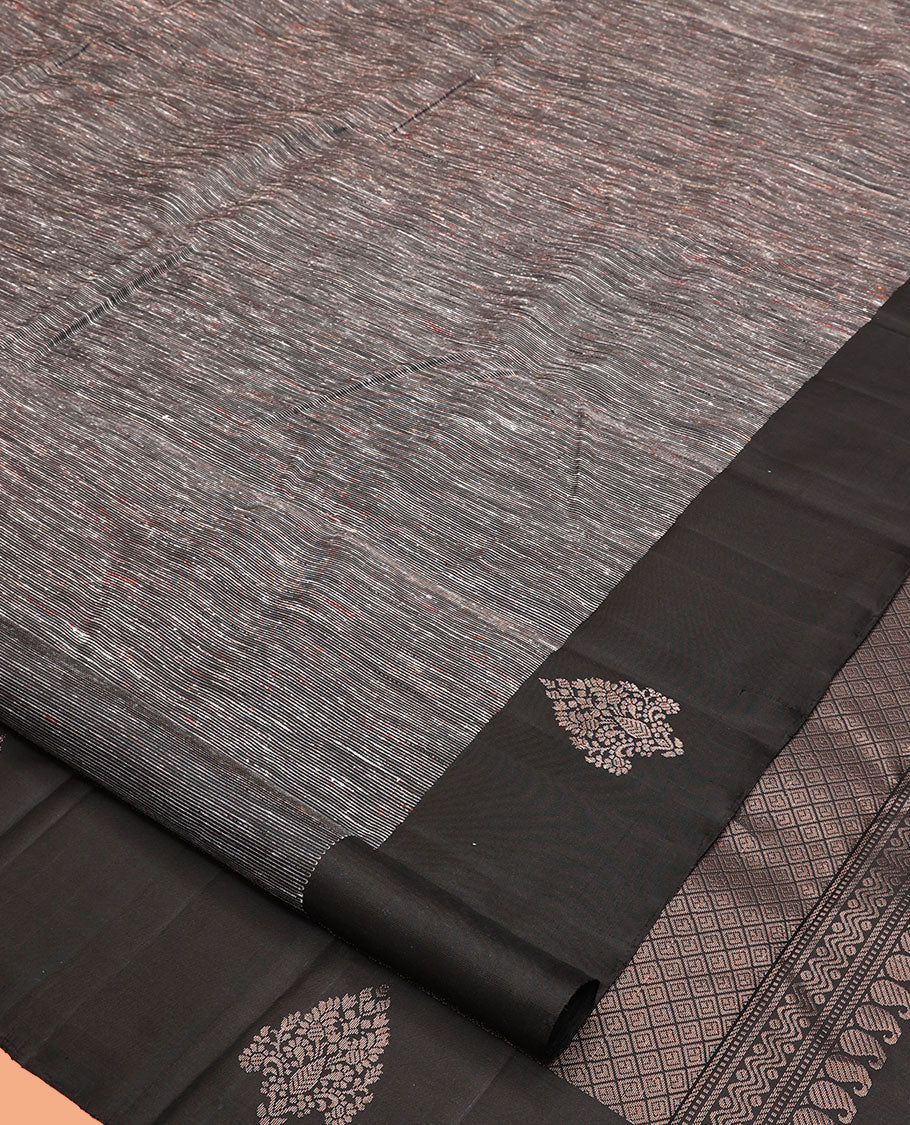 Black Kanchipuram Silk Saree, Decked Up with Ikat-Style Stripes, Highlighted By Floral Buttas Border, Grand Jaal Pallu, and a Matching Blouse