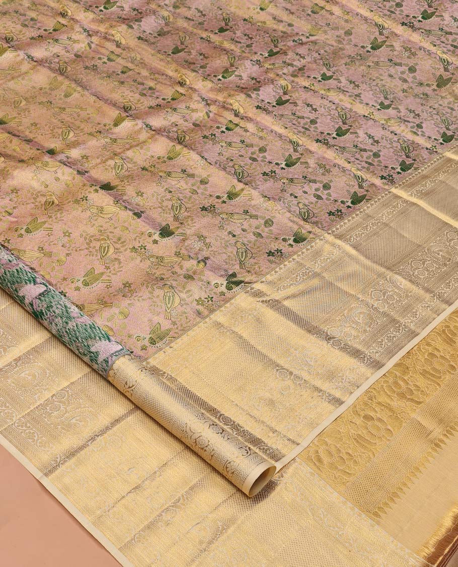 Pale Pink Kanchipuram Tissue Silk Saree, Decked Up with Floral-Bird Jacquard, a Contrast Border of Thilakam Mokku, Kodi Visiry, Mayil, and Mayil Kann, Intricate Pallu, and Contrast Blouse