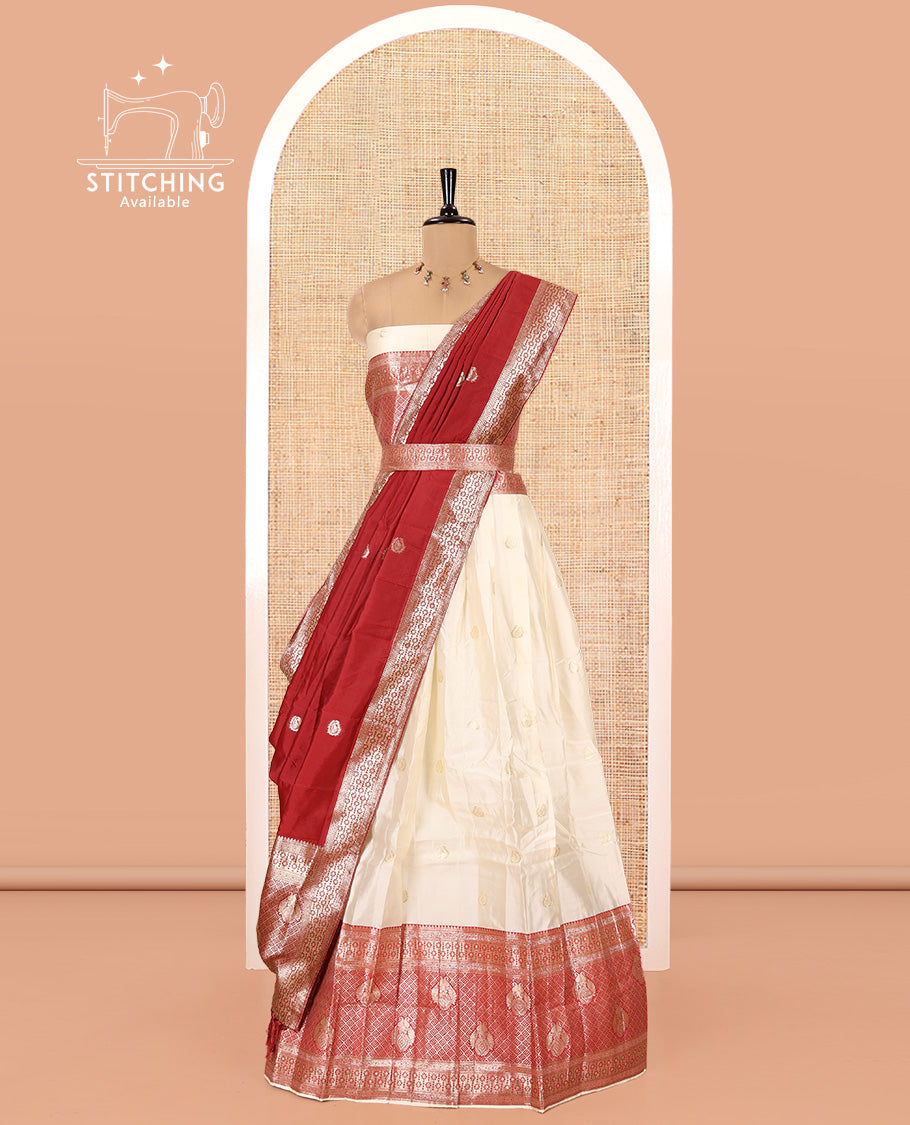 Cream-Red Semi-Banarasi Half-Saree Set Featuring Buttas Skirt, Contrast Traditional Border, Matching Blouse, and Banaras Dhavani