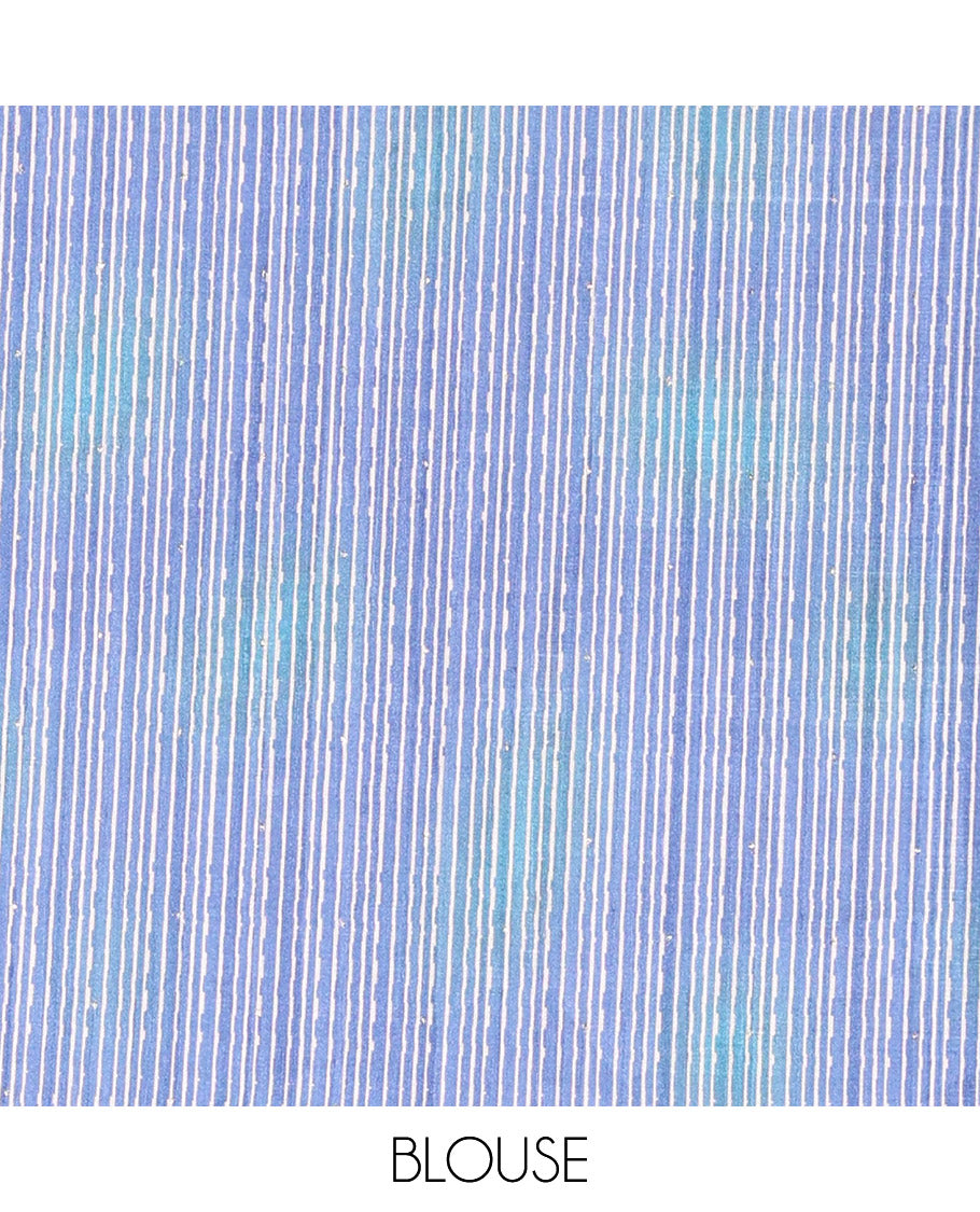 Blue sparkling dots and batik printed semi-tussar saree, contrast batik printed floral vine border, printed pallu, and a contrast printed blouse