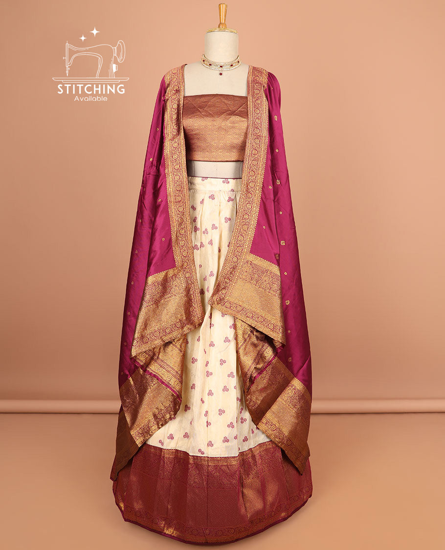 Cream buttas half saree with contrast zari design border, zari design blouse & dark pink floral vine zari design dhavani