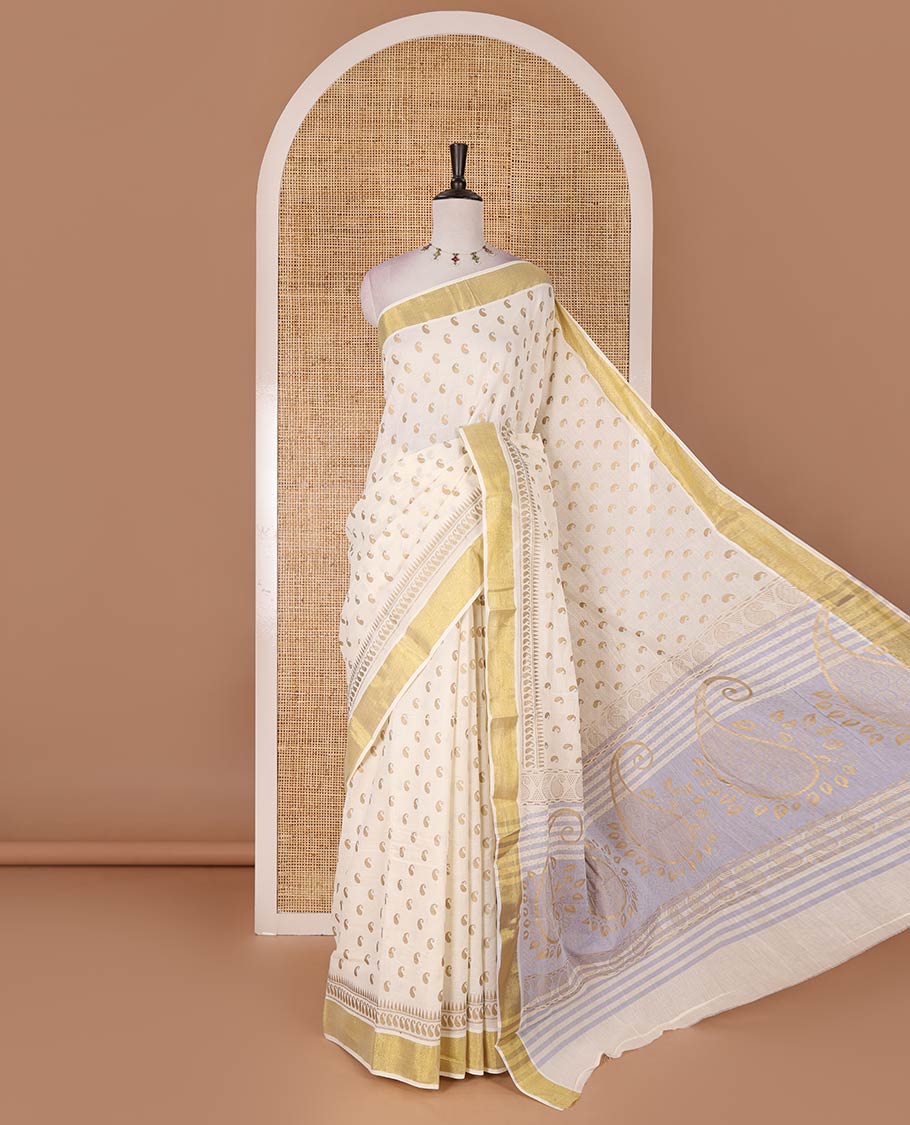 Cream manga butta golden foil printed Kerala cotton saree, zari border, pallu of paisley motifs, and a matching blouse