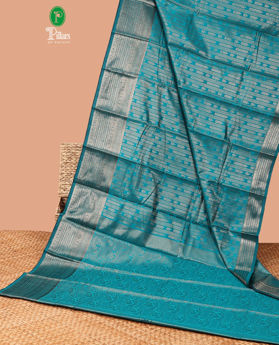 Peacock green zig zag straight line leaf design elite silk saree , gold rose zari with veldari border , malli mokku design & rich pallu , rose gold brocade design blouse