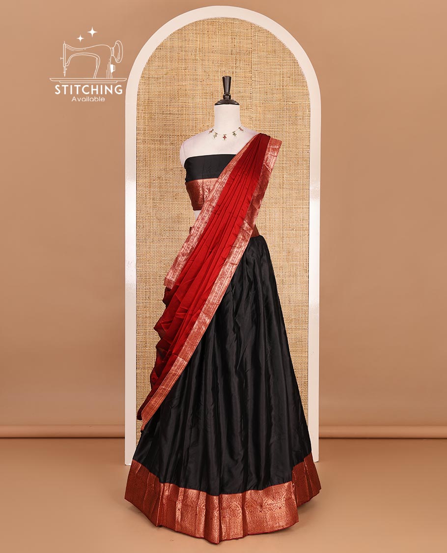 Black taffeta silk half saree, zari buttas with contrast red traditional zari border skirt, matching zari design blouse, and contrast plain zari border syska georgette dhavani
