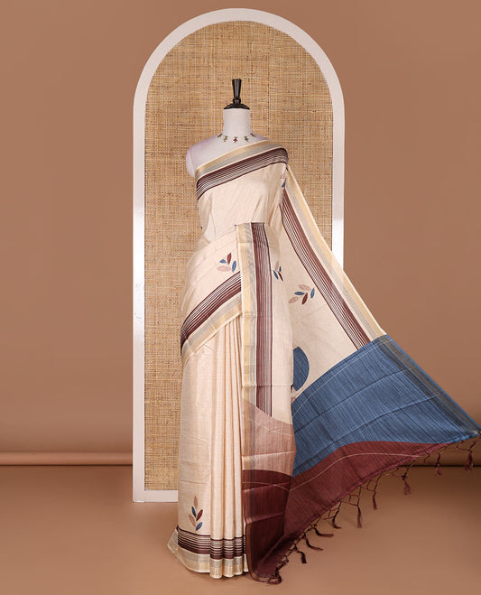 Chikku leaf themed printed soft tussar saree, contrast golden zari horizontally striped border, dual color textured pallu, and contrast plain blouse
