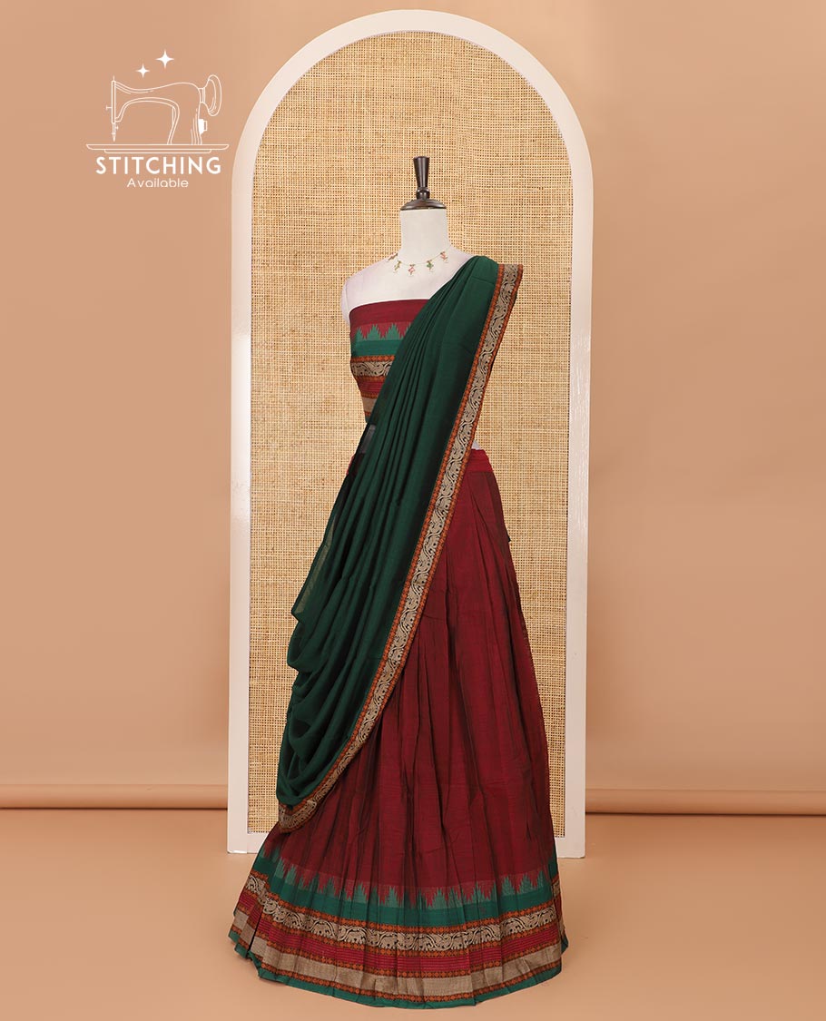 Maroon mercedised cotton half-saree, contrast traditional resham thread border skirt, matching blouse & contrast green thread border georgette dhavani