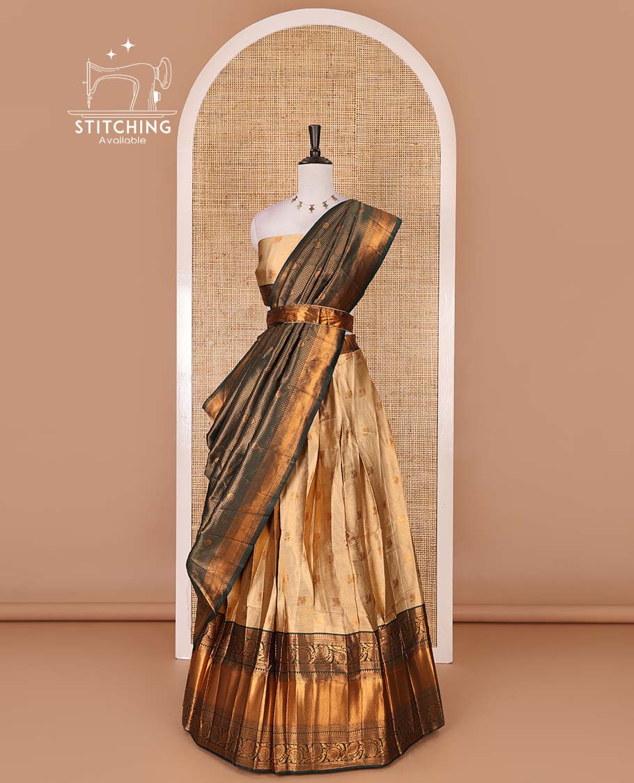 Gold banaras half saree, zari buttas with contrast bottle green traditional zari border skirt, matching blouse, dhavani of zari checks, and buttas