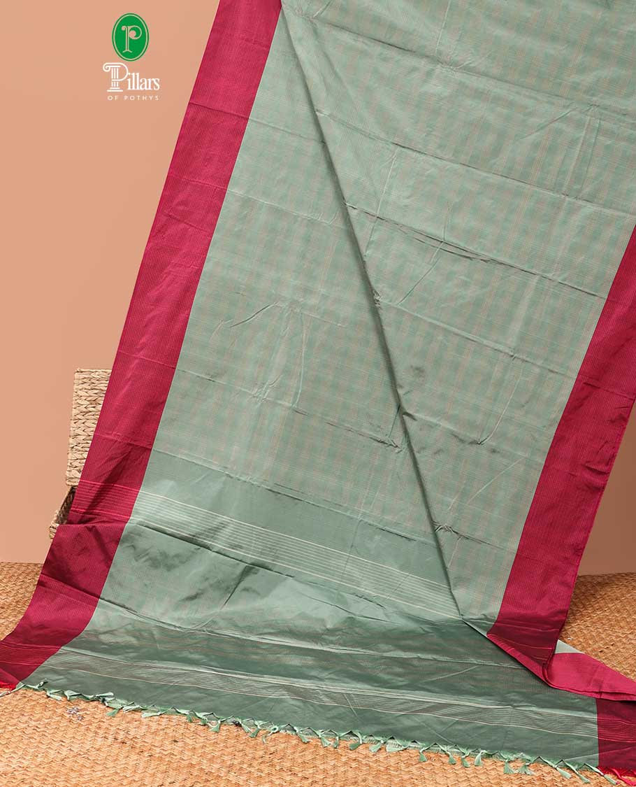 Light green copper zari checks bhavishna silk saree contrast line zari border & contrat blouse