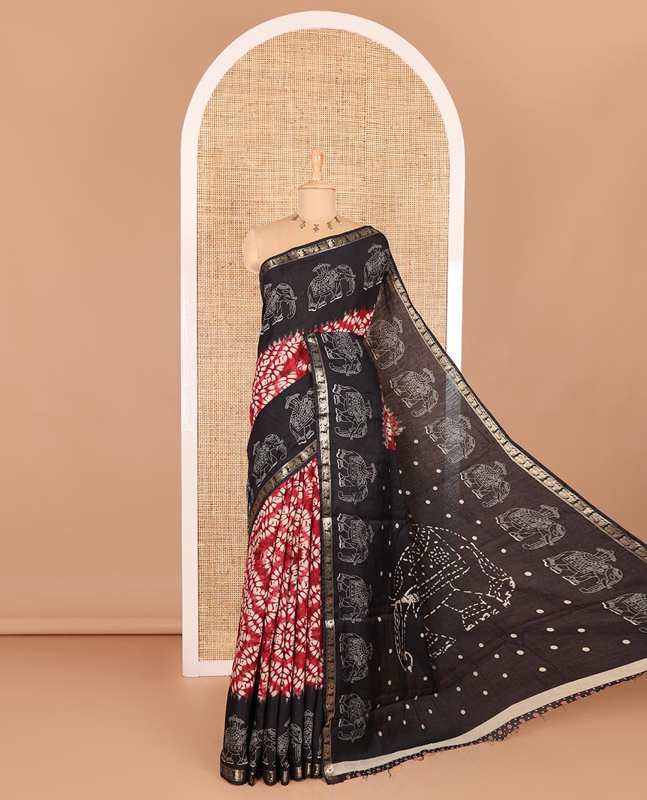 Red shibori printed muslin cotton saree, contrast zari border of elephant motifs print, big elephant printed pallu, and a contrast printed blouse