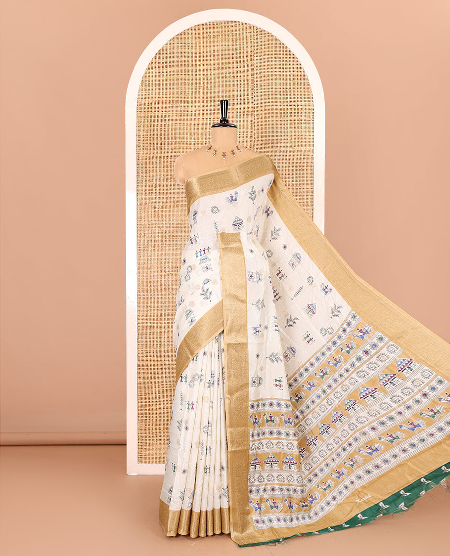Half-white buttas with warli village motifs printed dola silk saree, contrast traditional zari border of paisleys, warli printed pallu, and a contrast printed blouse