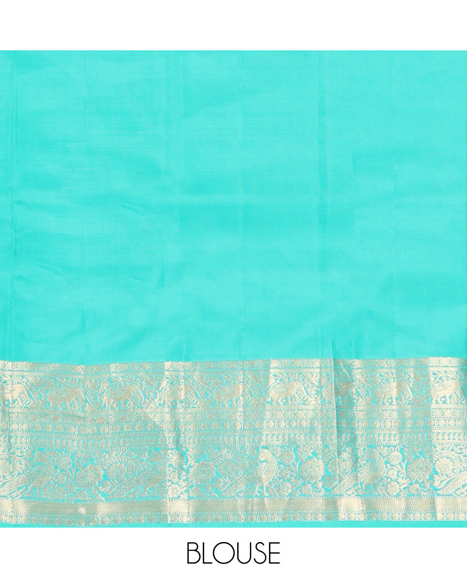 Blue Vasundhara Silk Saree, Accentuated with Zari Buttas and Stripes, a Zari Border of Kathir, Yaanai, Rudraksham, Manga, and Mayil Design, a Grand Pallu, and a Matching Blouse