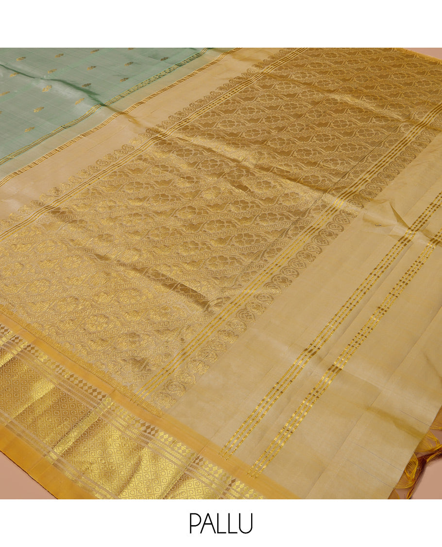 Green Kanchipuram Silk Saree, Woven with Zari Buttas, a Contrast One-Sided Border of Panner Sombu, Banaras, and Jaal Designs, Floral Creeper Pallu, and No Blouse
