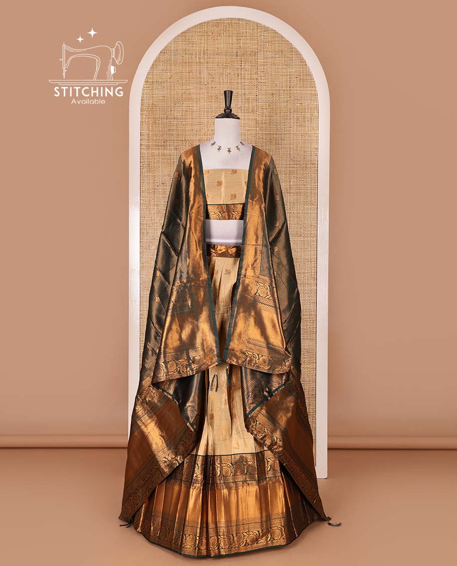 Gold banaras half saree, zari buttas with contrast bottle green traditional zari border skirt, matching blouse, dhavani of zari checks, and buttas