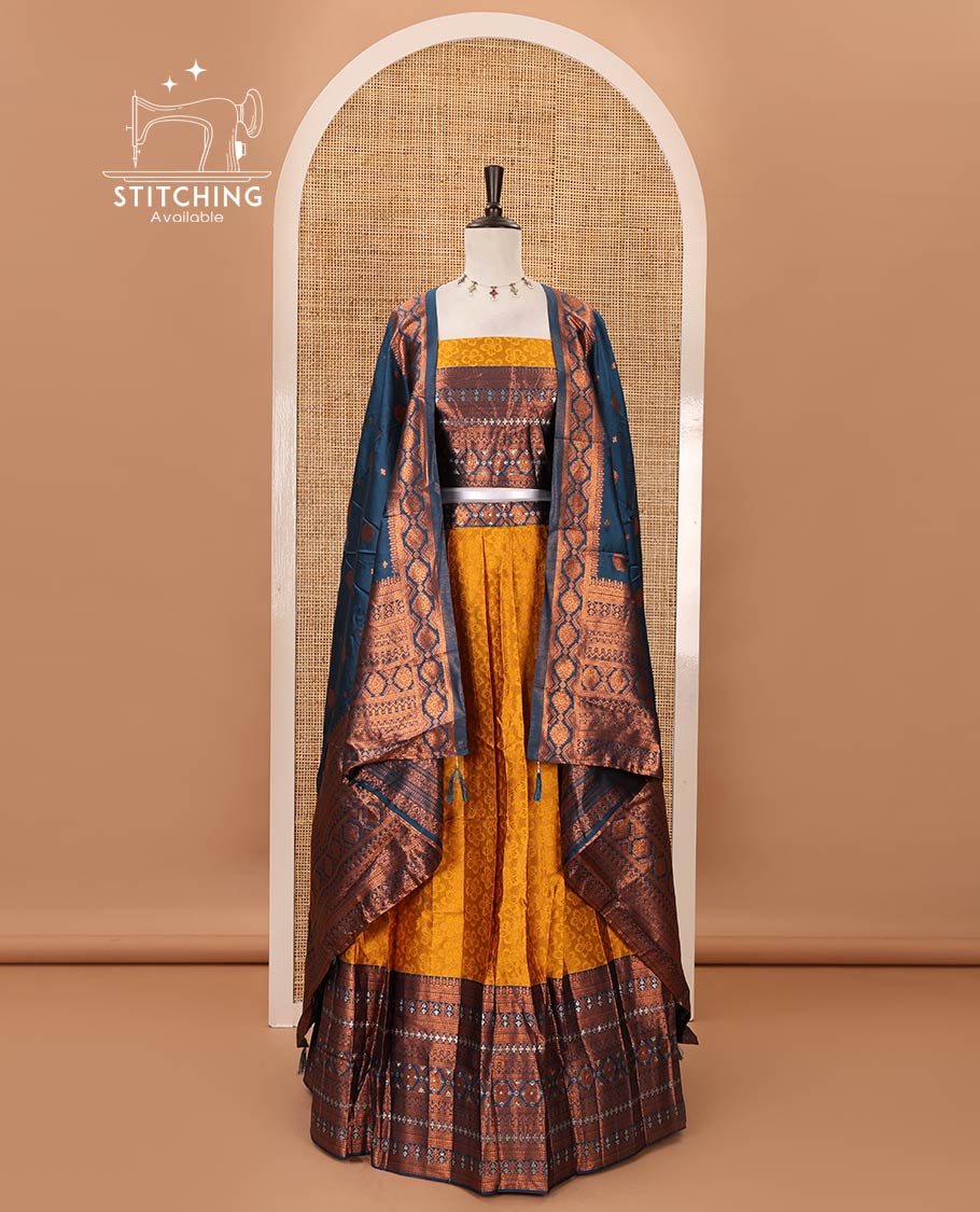 Mustard semi-banaras half-saree, embossed & contrast traditional zari border skirt,blouse of embossed & zari work & contrast-blue zari design dhavani