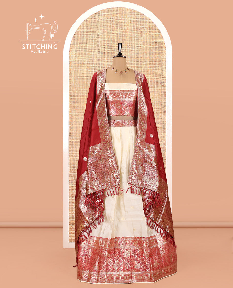 Cream-Red Semi-Banarasi Half-Saree Set Featuring Buttas Skirt, Contrast Traditional Border, Matching Blouse, and Banaras Dhavani