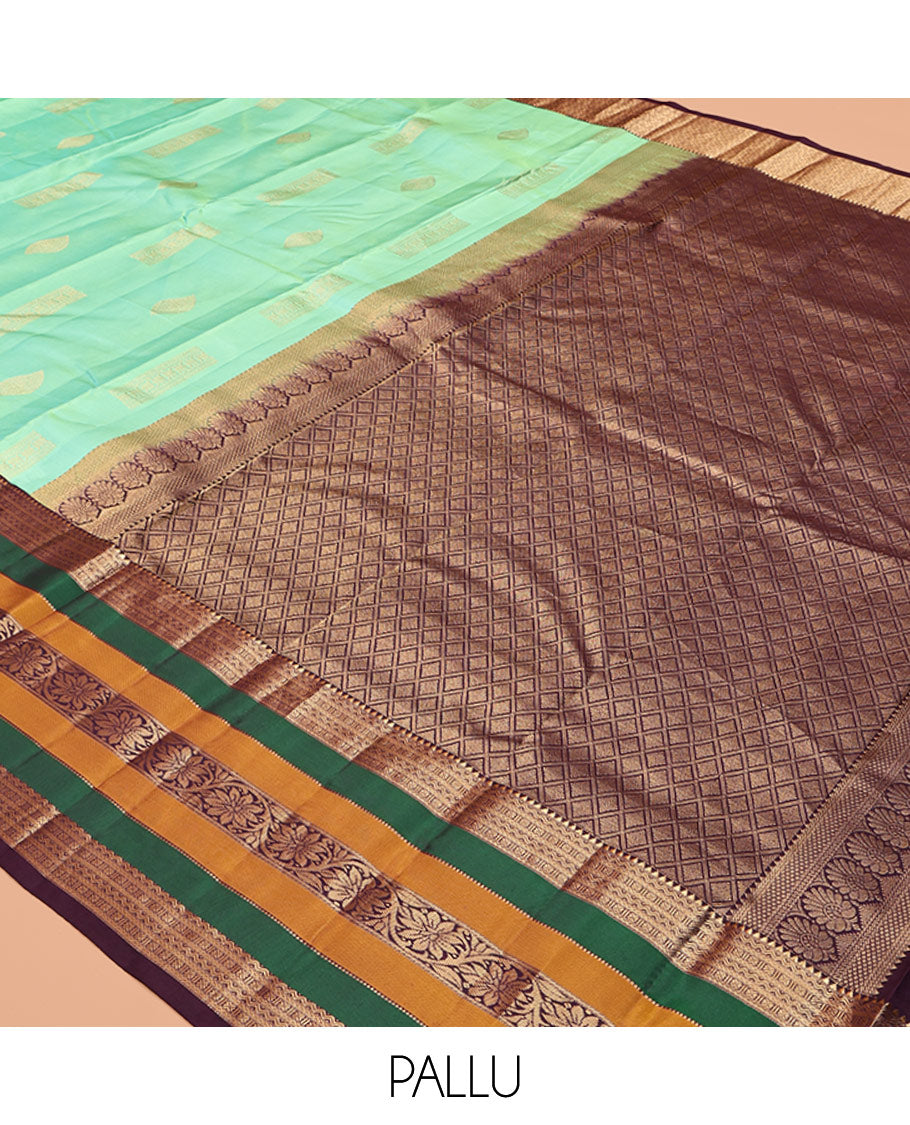 Sea Green Vasundhara Silk Saree, Elevated with Zari Buttas, Contrast Traditional Kodi Visiry Border, Grand Jaal Pallu, and a Contrast Blouse