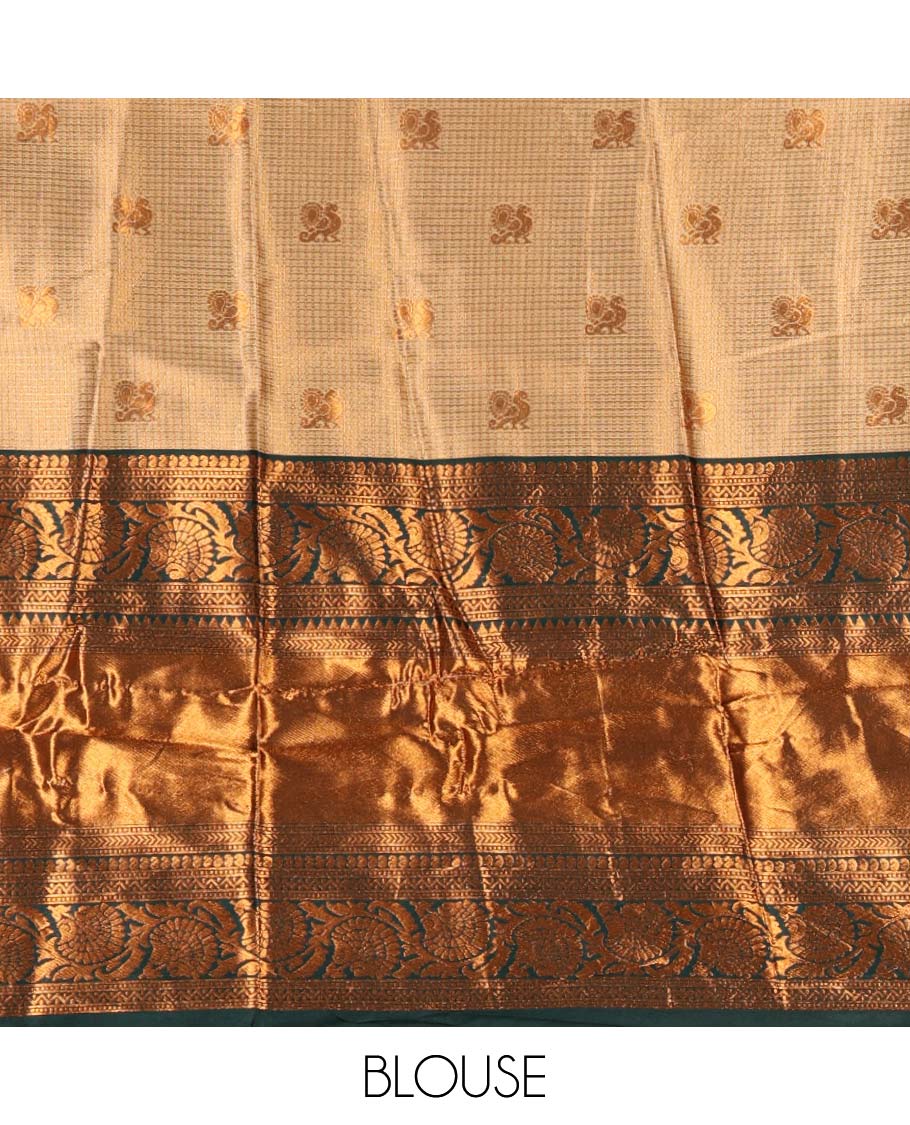 Gold banaras half saree, zari buttas with contrast bottle green traditional zari border skirt, matching blouse, dhavani of zari checks, and buttas