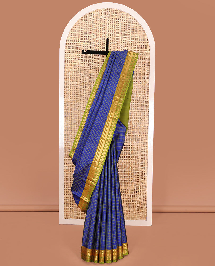 Blue checked Kanchipuram silk saree, contrast border of salngai, kathir, mayil kann, and mayil kann designs, and zari striped pallu