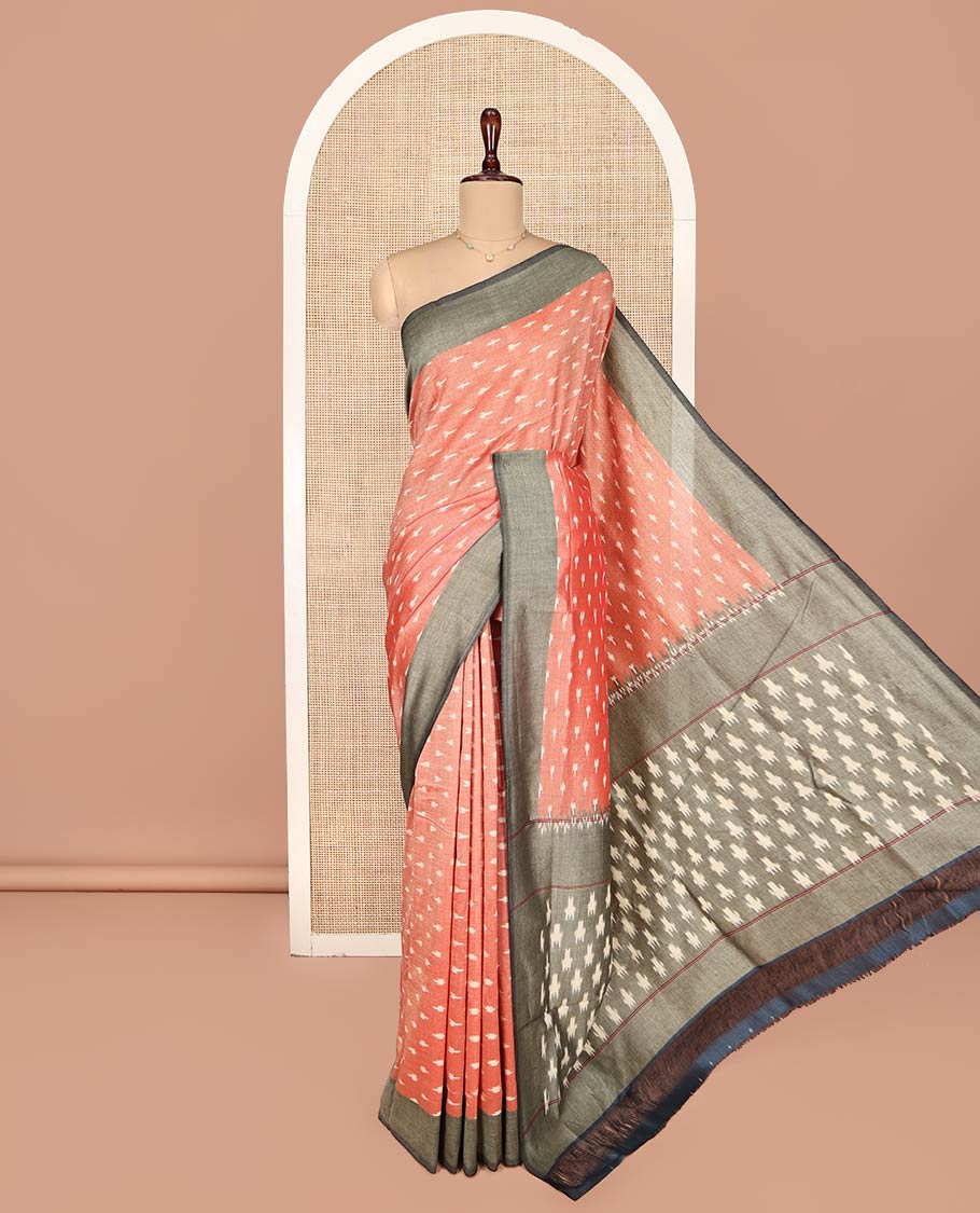 Orange Ikkat Cotton Saree, Embellished with Buttas on Its Body, Complemented by a Contrast Border, Pallu of Ikkat-Style Buttas, and Has No Blouse