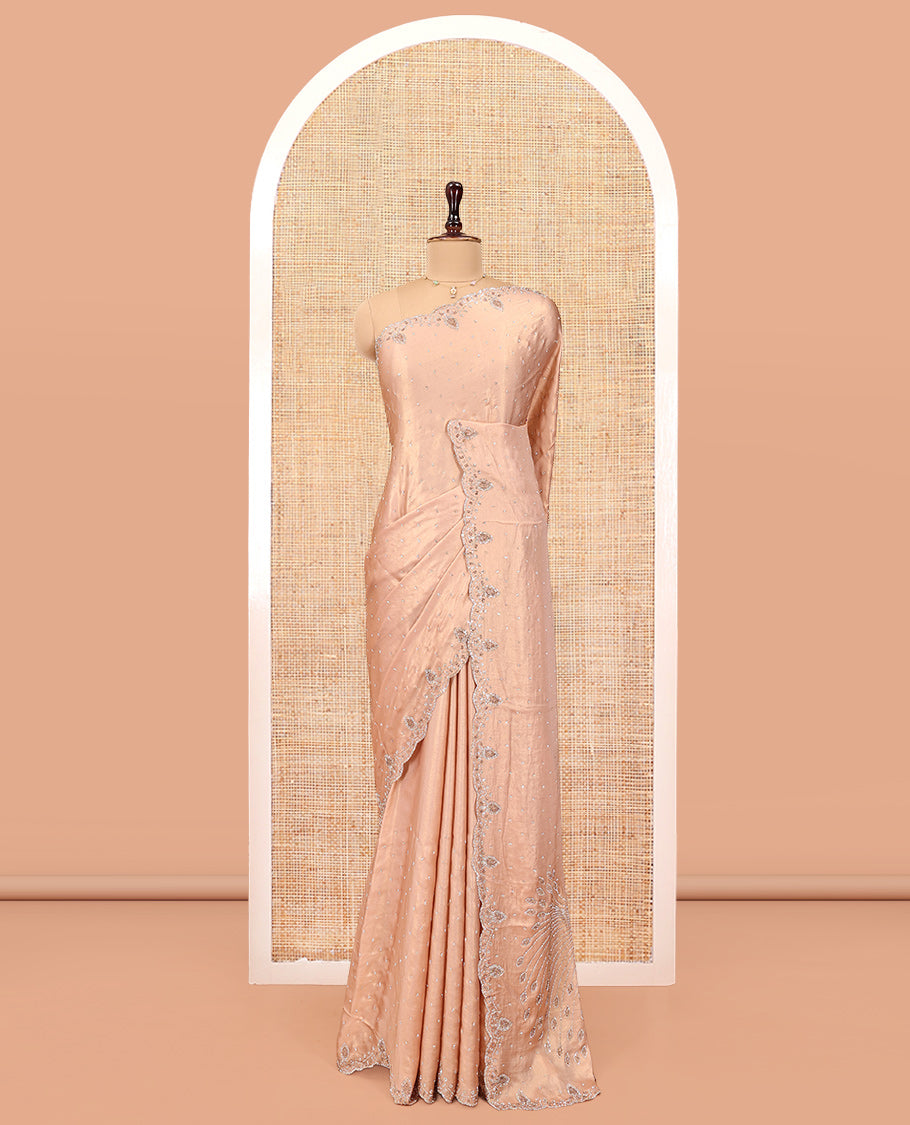Champagne Designer Saree Gleamed up with Stone Work On Its Body, Scallop Embroidered Border, and Paired with a Heavy Embroidered Matching Blouse