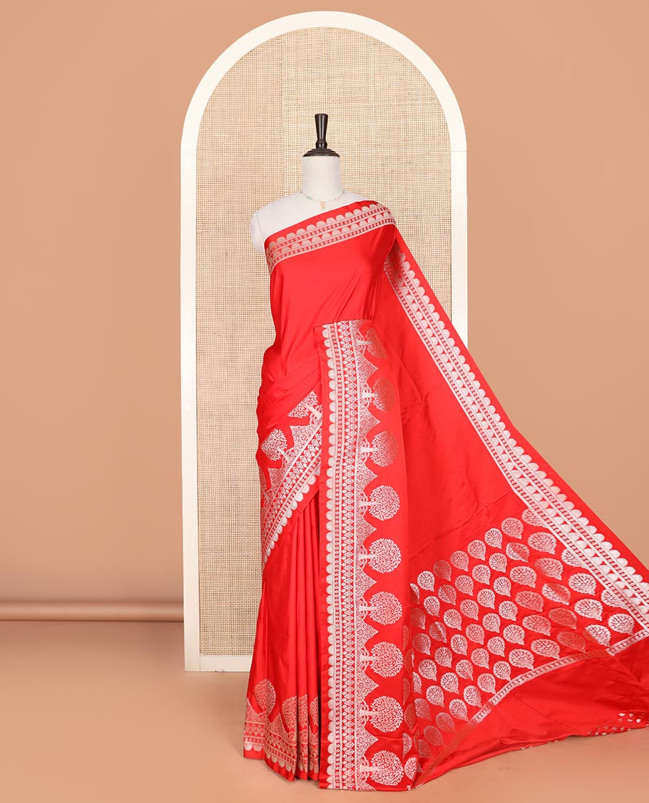 Red plain mushru silk saree, self-border of scallop design, floral, and tree motifs, and intricately designed pallu