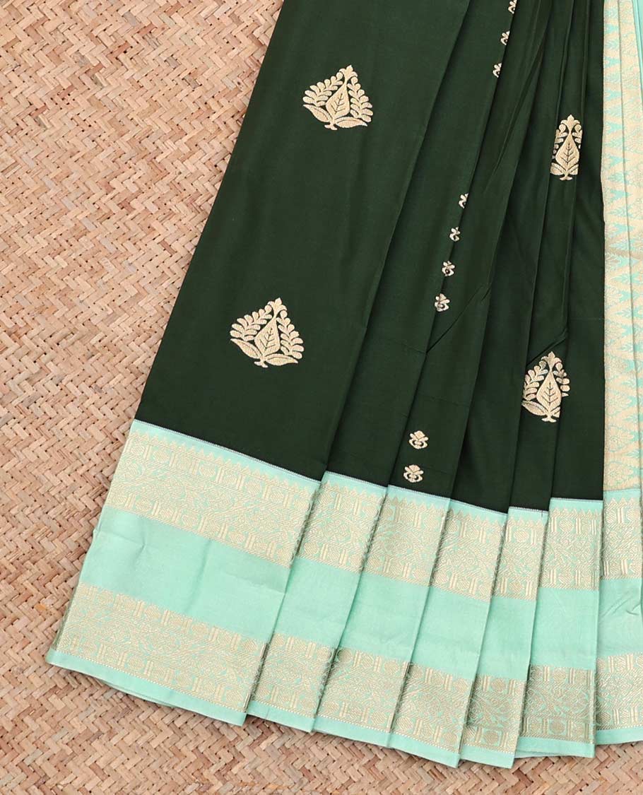 Green Budget Silk Saree, Ornamented With Zari Buttas All Over Its Body, Complemented by Contrast Rettai Pettu Border of Traditional Zari Designs, Sparsely Woven Pallu, and Paired with a Contrast Blouse
