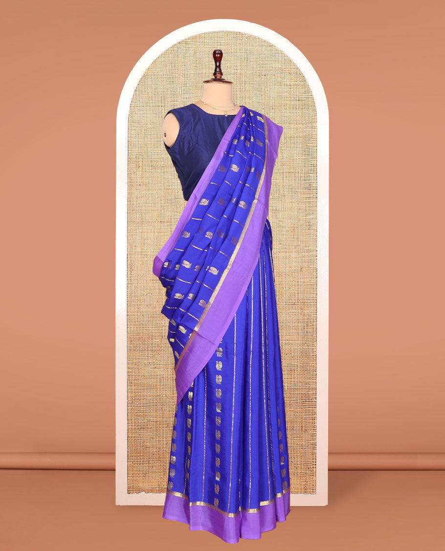 Blue Mysore Silk Saree, Gracefully Decked Up with Peacock Buttas and Stripes Across Its Body, Complemented by Contrast Border, Pallu Steeped with Traditional Zari Designs, and Paired with a Contrast Blouse