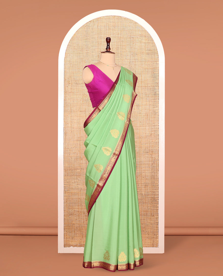 Green Mysore Silk Saree Prettified with Zari Buttas All Over Its Body, Complemented by Captivating Contrast Border of Traditional Zari Designs, Zari Designs Woven Pallu, and Paired with a Contrast Blouse