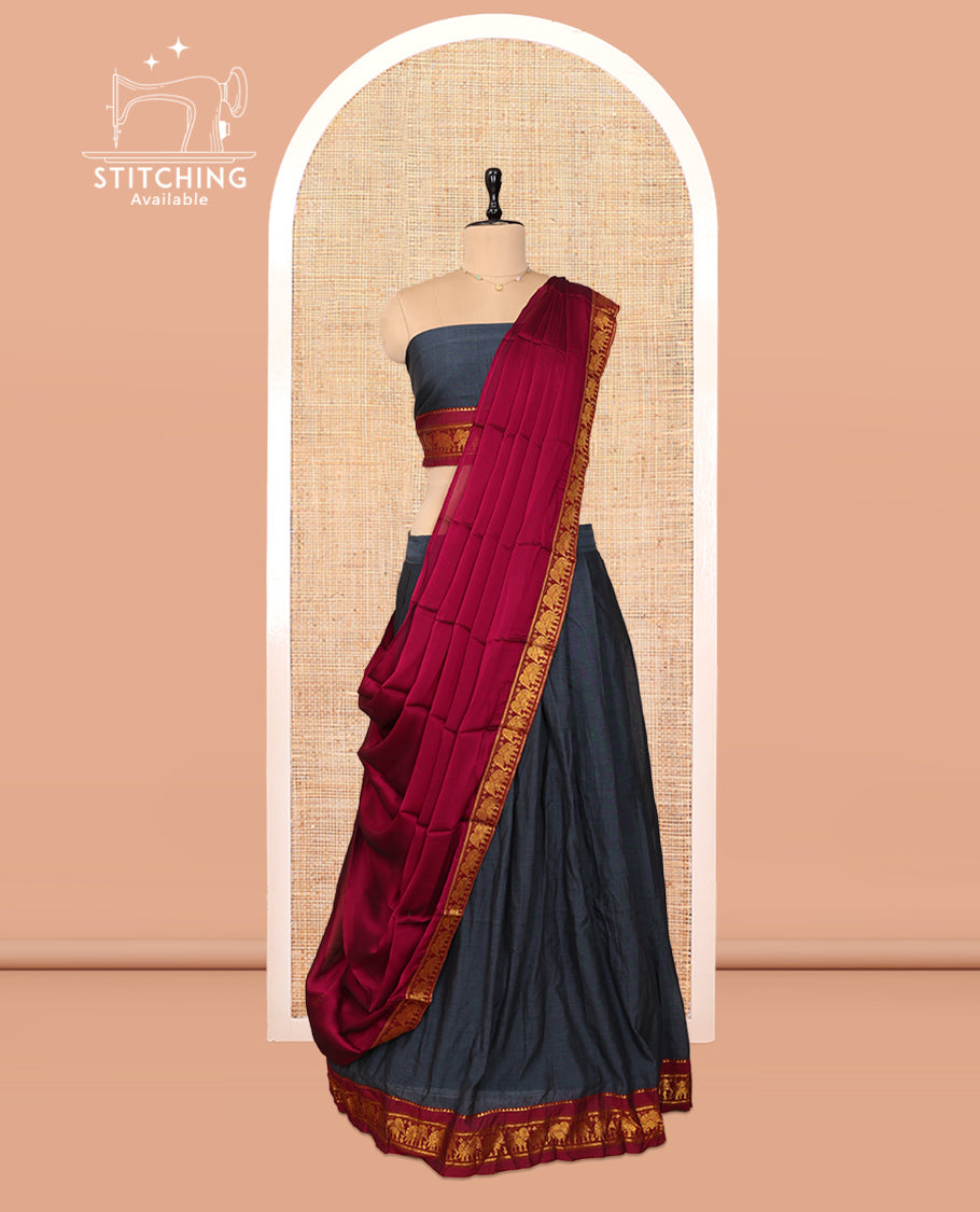 Grey Cotton Half-Saree Features Plain Skirt, a Contrast Elephant Border, a Matching Blouse, and a Contrast Dhavani