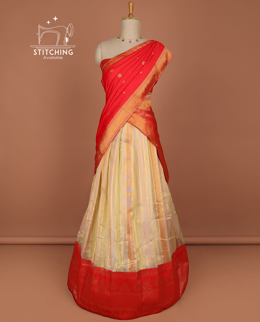 Multi-color striped half saree with contrast floral zari design border, checked zari design blouse & floral zari design dhavani