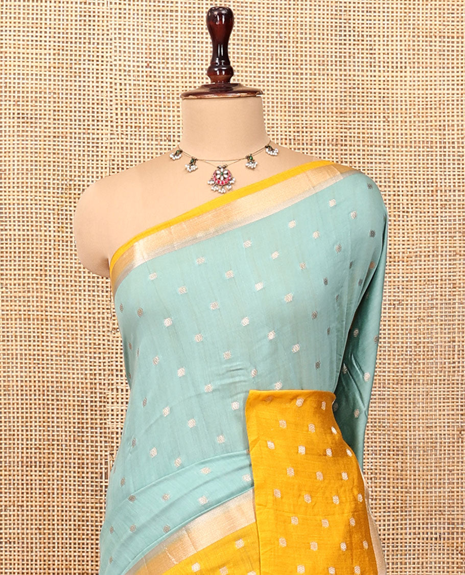 Pale Blue Assam Silk Saree, Steeped with Zari Buttas, Complemented by Contrast Zari Buttas Woven Border, Gleaming Pallu, and Contrast Blouse