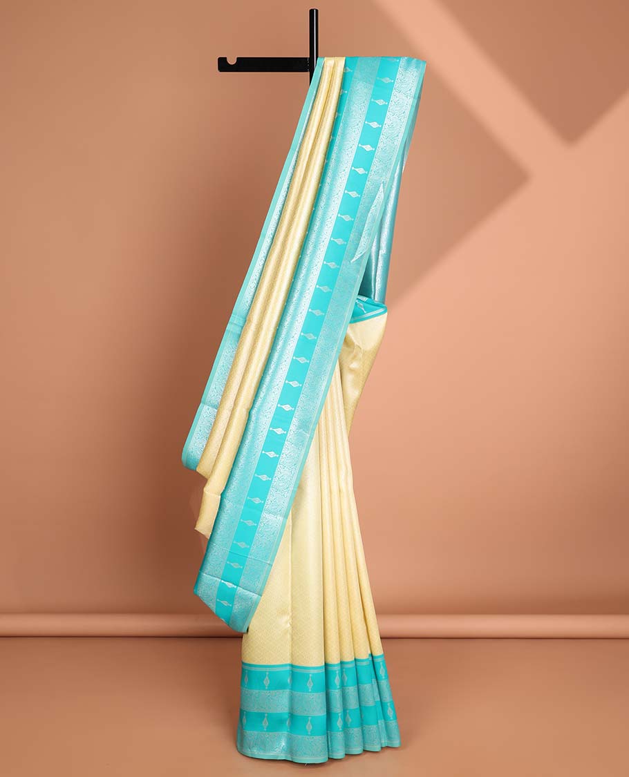 Lemon yellow floral jacquard litchi silk saree with contrast zari design border &floral jaal design pallu