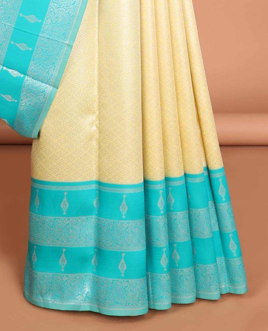 Lemon yellow floral jacquard litchi silk saree with contrast zari design border &floral jaal design pallu