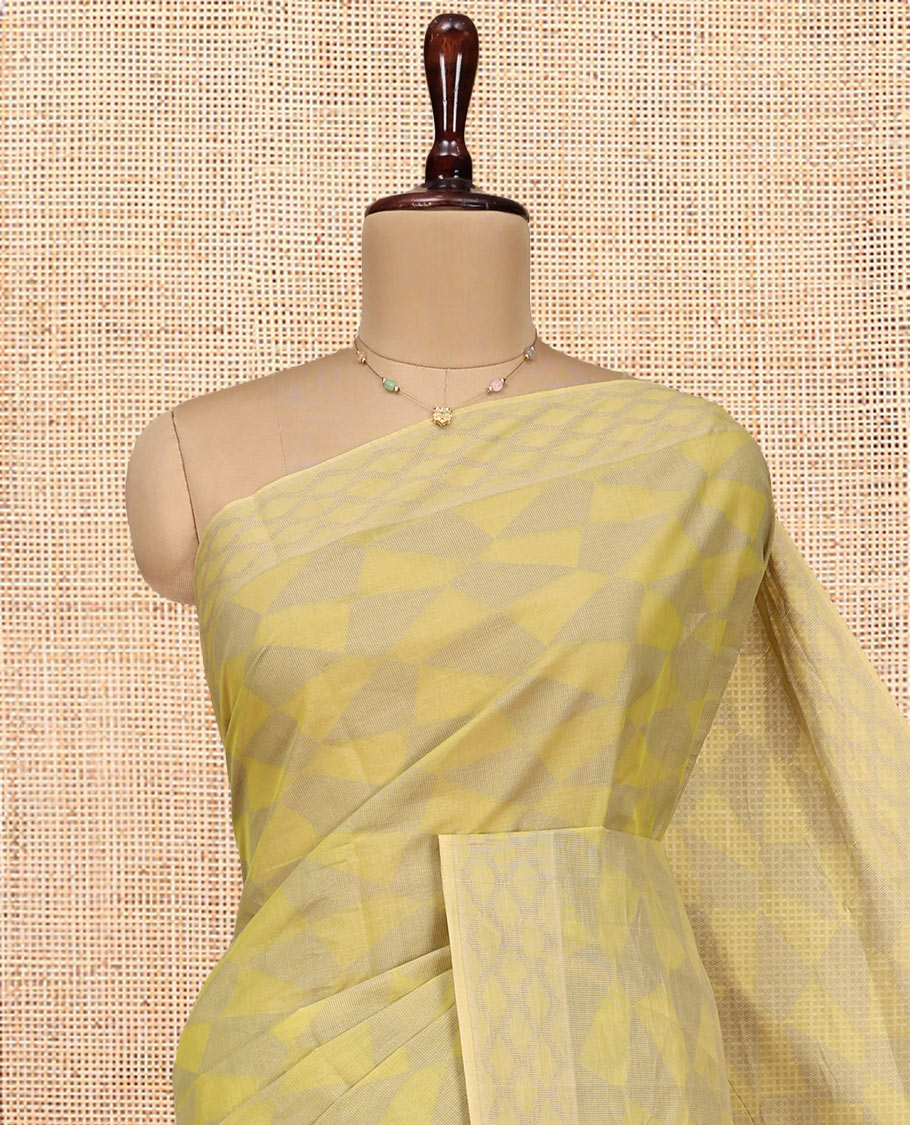 Pale Green Coimbatore Cotton Saree, Subtly Sparkled with Geometric Design on Its Body, a Subtle Diamond Border, Pallu of Ogee Patterns, and Paired with Matching Blouse