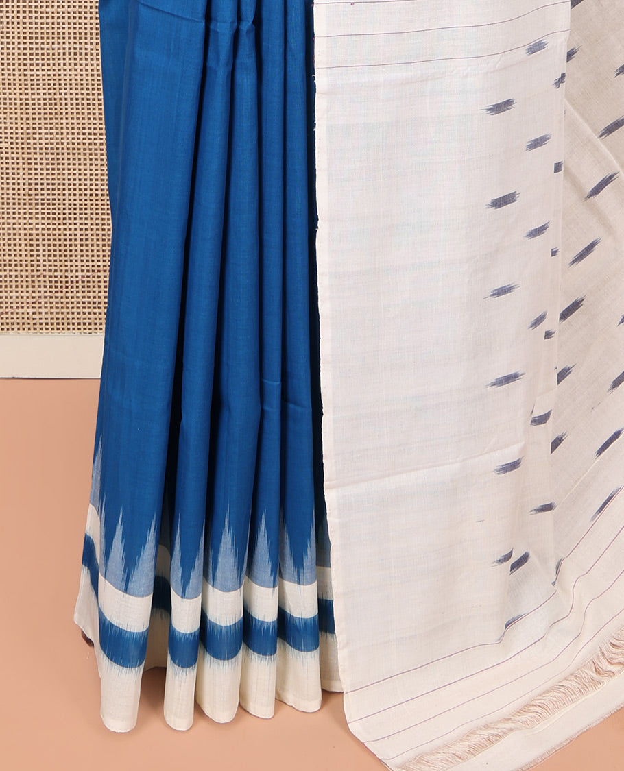 Blue Plain Ikkat Cotton Saree, Complemented by a Contrast Ikkat Temple Border, Pallu Steeped with Buttas, and Paired with a Contrast Blouse