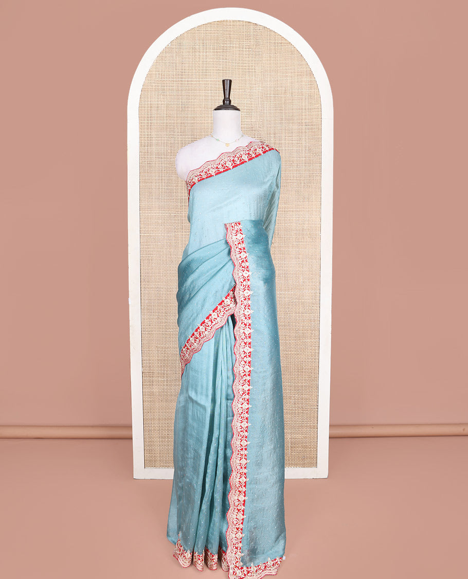 Blue Designer Saree, Gleamed with Stone Work Across Its Body, Complemented by a Contrast Scallop Patch-Embroidered Border, a Self Pallu, and Paired with Matching Blouse Featuring Embroidery and Bandhani Dots