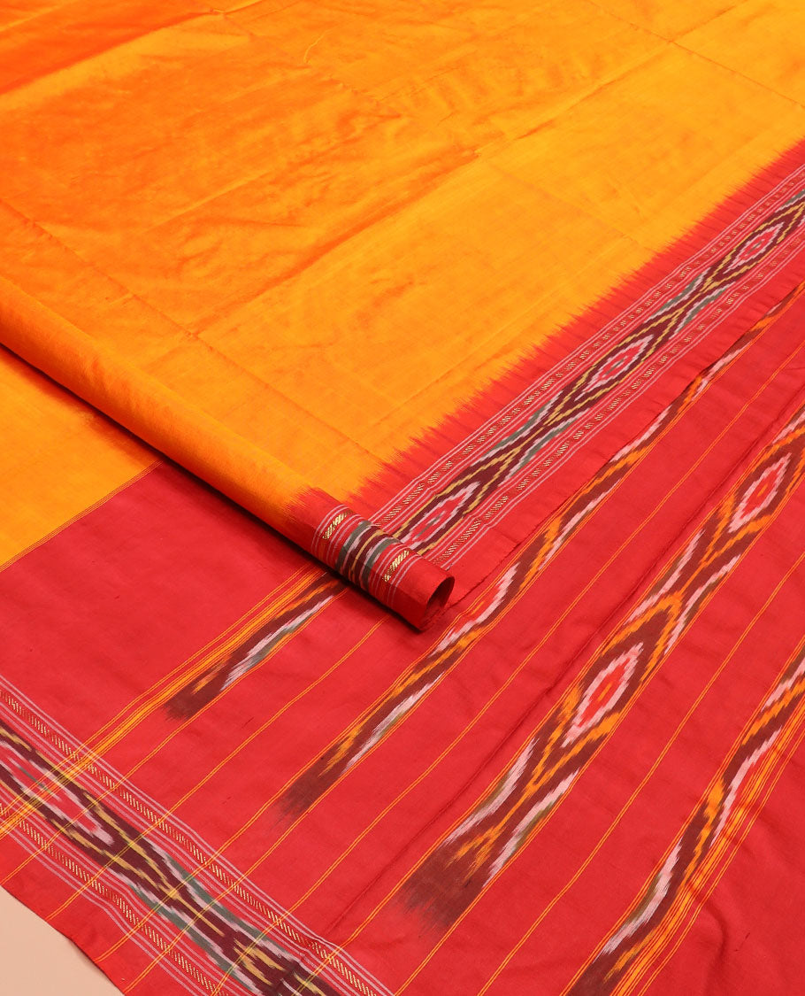 Orange Plain Ikkat Silk Saree with a Contrast Red Border Adorned by a Hazy Ikkat Weave, Featuring a Pallu Flanked by Stripes and Ikkat Texture