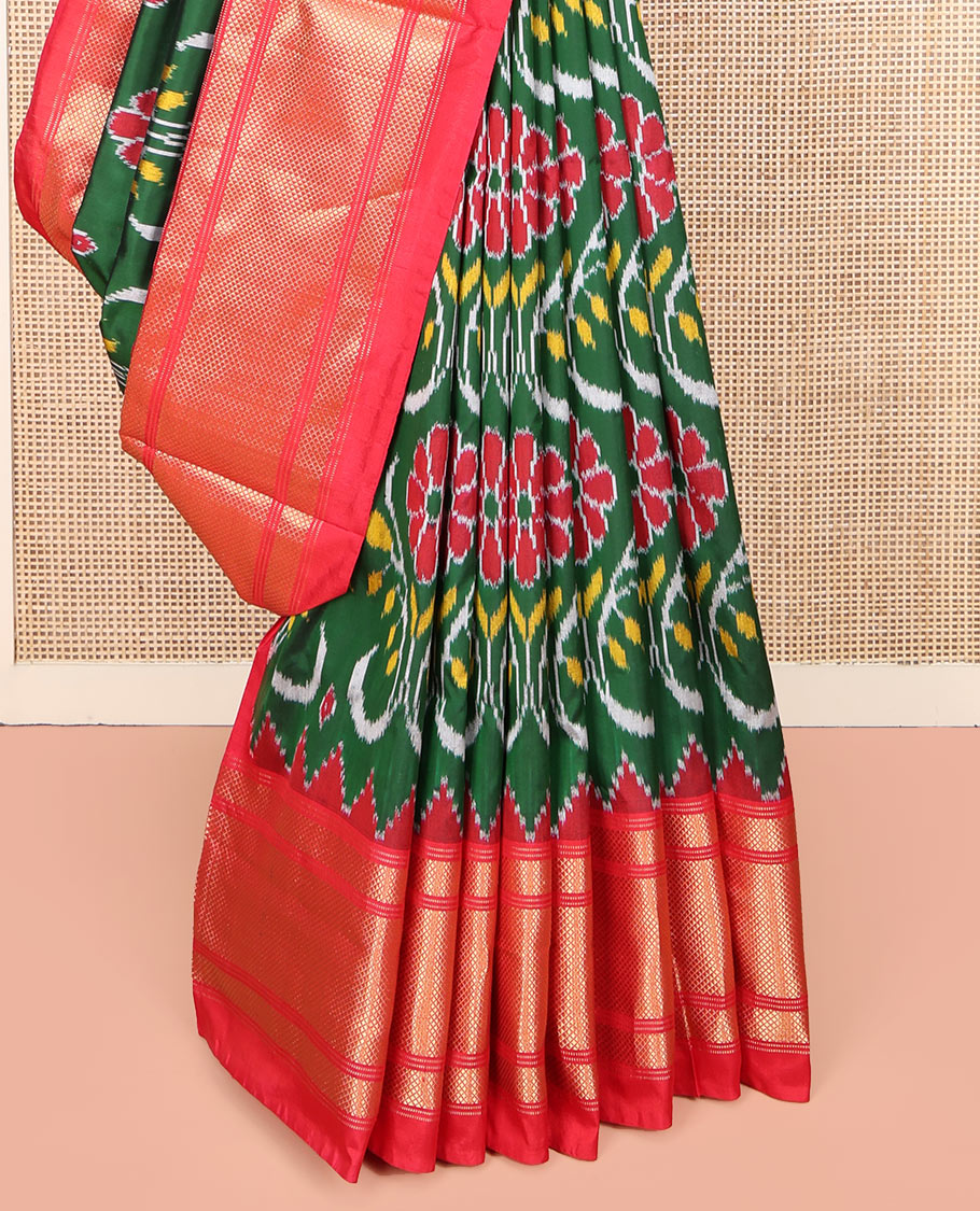 Green Ikkat Silk Saree, Enriched with Ikkat Floral Designs All Over Its Body, Complemented by a Contrast Temple Border of Diamond Zari Designs, Pallu of Floral Ikkat Designs, and Paired with a Contrast Blouse